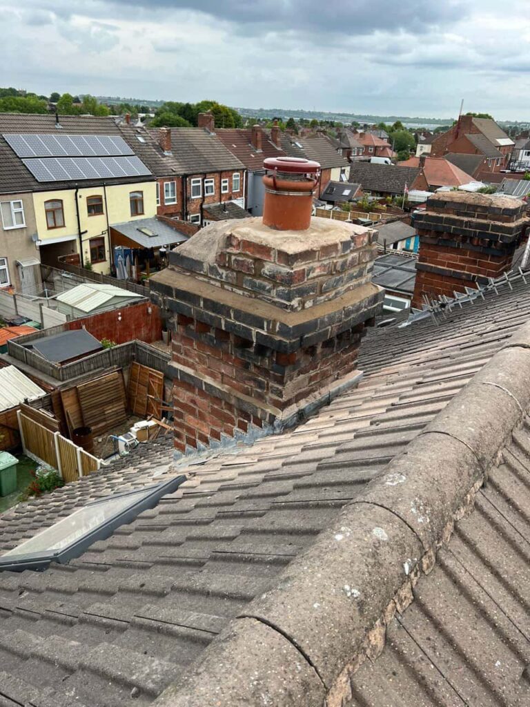 This is a photo taken from a roof which is being repaired by Godstone Roofing Repairs, it shows a street of houses, and their roofs